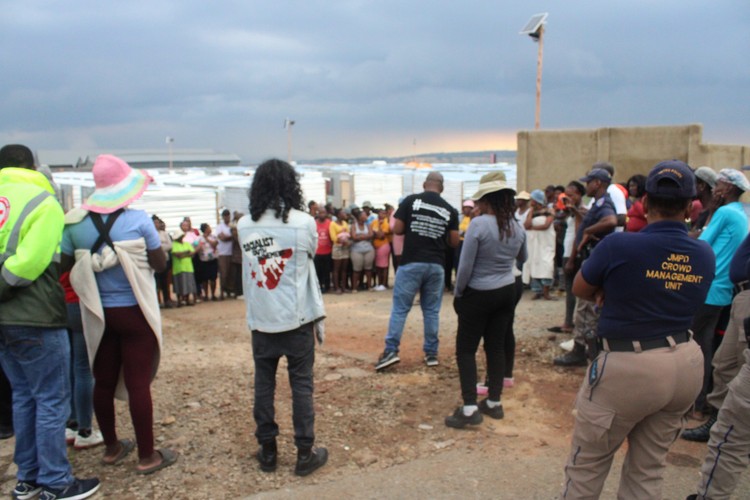 Joburg building fire survivors demand better housing after their settlement floods GroundUp